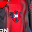 Camisa Cerro Portenho I 23/24 - Torcedor Puma Masculina - Vermelha com detalhes em azul e branca