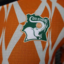 Camisa Seleção Costa do Marfim Pré-Jogo 23/24 - Jogador Puma Masculina - Laranja com detalhes em branco e verde