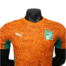 Camisa Costa do Marfim I 26/27 - Jogador Puma Masculina - Laranja com detalhes em verde