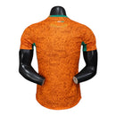 Camisa Costa do Marfim I 26/27 - Jogador Puma Masculina - Laranja com detalhes em verde
