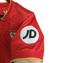 Camisa Sevilla II 23/24 - Torcedor Castore Masculina - Vermelha com ondulações cinza e dourado