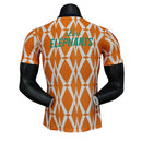 Camisa Seleção Costa do Marfim Pré-Jogo 23/24 - Jogador Puma Masculina - Laranja com detalhes em branco e verde