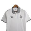 Camisa Real Madrid Polo 23/24 - Torcedor Adidas Masculina - Branca com detalhes em preto