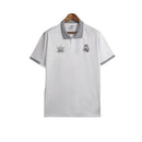 Camisa Real Madrid Polo 23/24 - Torcedor Adidas Masculina - Branca com detalhes em preto