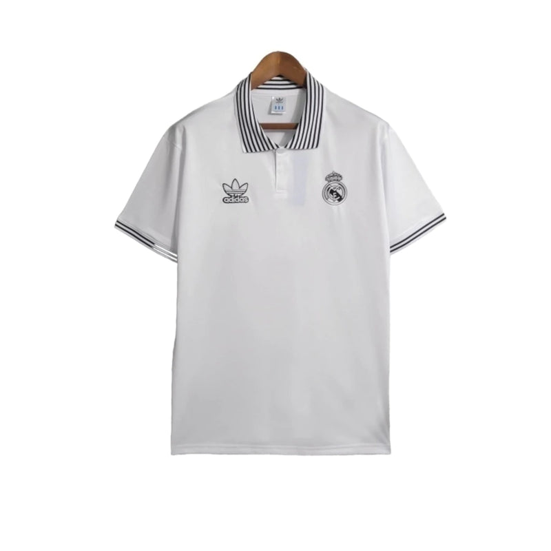 Camisa Real Madrid Polo 23/24 - Torcedor Adidas Masculina - Branca com detalhes em preto